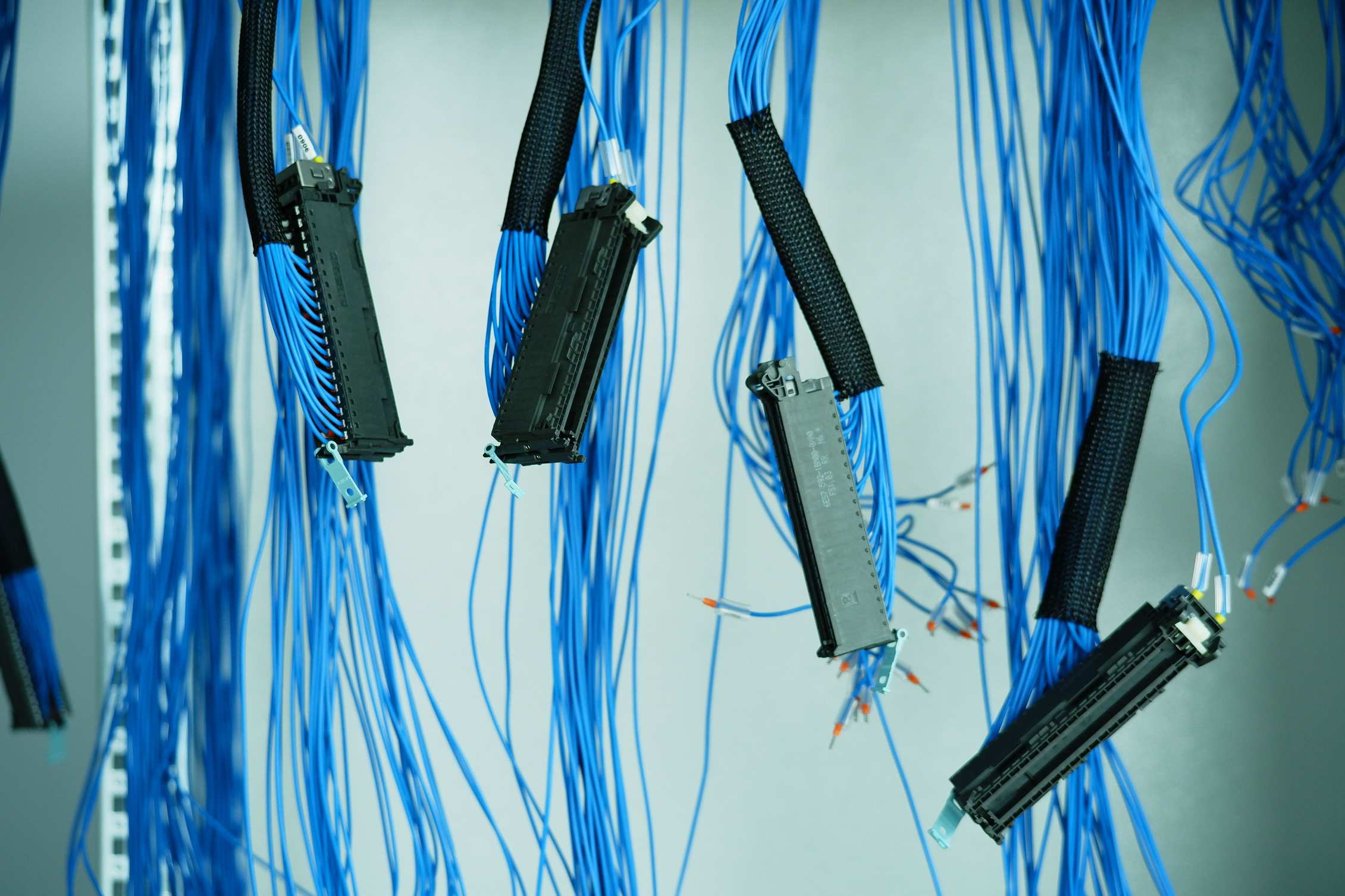 Server room aisle with racks and cabling in a technology workspace
